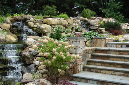 Bolton Landscape Design & Masonry specializing in plantings, sprinkler systems, patios, grills, driveway construction, and grading since 1979.