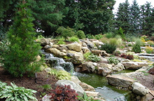 Bolton Landscape Design & Masonry specializing in plantings, sprinkler systems, patios, grills, driveway construction, and grading since 1979.