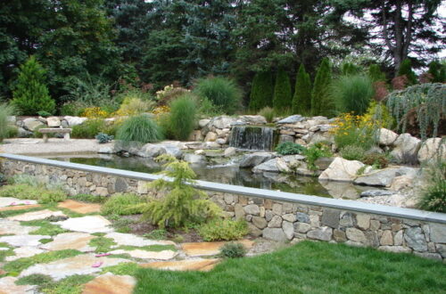 Bolton Landscape Design & Masonry specializing in plantings, sprinkler systems, patios, grills, driveway construction, and grading since 1979.