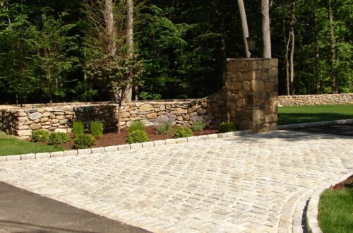 Bolton Landscape Design & Masonry specializing in plantings, sprinkler systems, patios, grills, driveway construction, and grading since 1979.