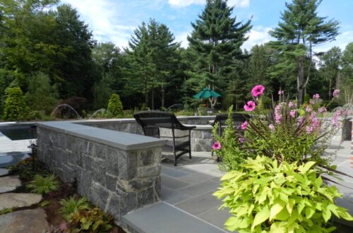 Bolton Landscape Design & Masonry specializing in plantings, sprinkler systems, patios, grills, driveway construction, and grading since 1979.