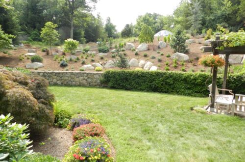 Bolton Landscape Design & Masonry specializing in plantings, sprinkler systems, patios, grills, driveway construction, and grading since 1979.