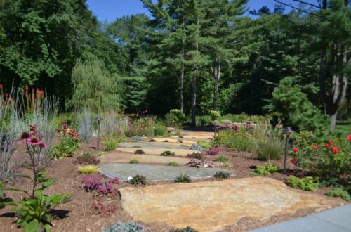 Bolton Landscape Design & Masonry specializing in plantings, sprinkler systems, patios, grills, driveway construction, and grading since 1979.