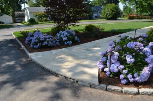 Bolton Landscape Design & Masonry specializing in plantings, sprinkler systems, patios, grills, driveway construction, and grading since 1979.