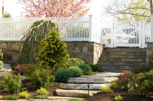 Bolton Landscape Design & Masonry specializing in plantings, sprinkler systems, patios, grills, driveway construction, and grading since 1979.