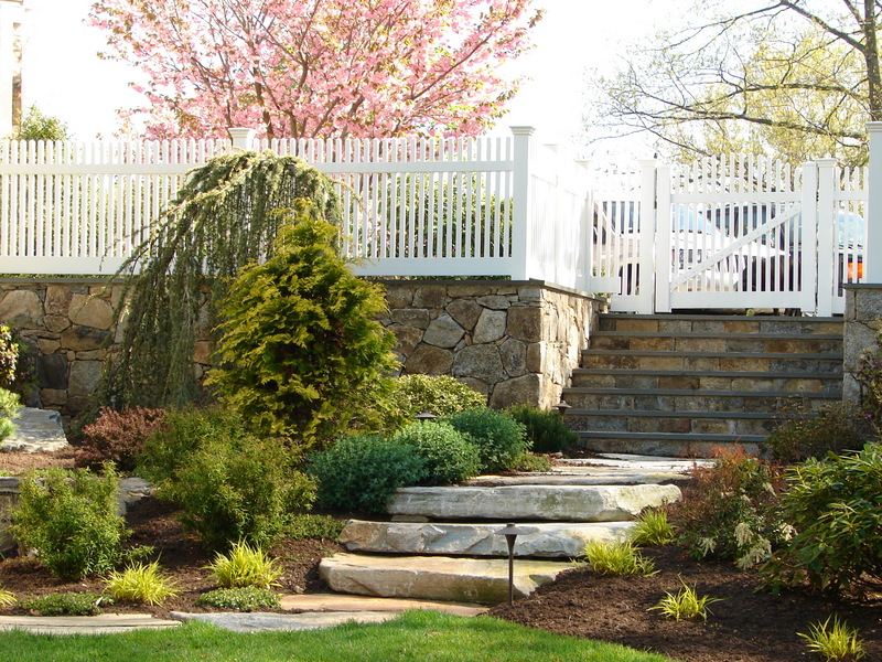 Bolton Landscape Design & Masonry specializing in plantings, sprinkler systems, patios, grills, driveway construction, and grading since 1979.