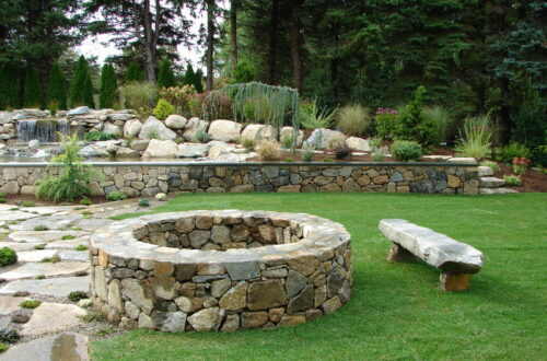 Bolton Landscape Design & Masonry specializing in plantings, sprinkler systems, patios, grills, driveway construction, and grading since 1979.