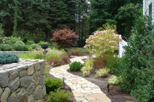 Bolton Landscape Design & Masonry specializing in plantings, sprinkler systems, patios, grills, driveway construction, and grading since 1979.