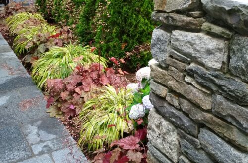 Bolton Landscape Design & Masonry specializing in plantings, sprinkler systems, patios, grills, driveway construction, and grading since 1979.