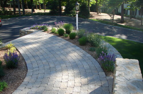 Bolton Landscape Design & Masonry specializing in plantings, sprinkler systems, patios, grills, driveway construction, and grading since 1979.