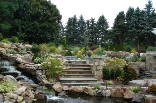 Bolton Landscape Design & Masonry specializing in plantings, sprinkler systems, patios, grills, driveway construction, and grading since 1979.