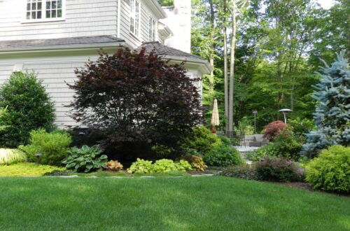 Bolton Landscape Design & Masonry specializing in plantings, sprinkler systems, patios, grills, driveway construction, and grading since 1979.