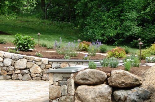 Bolton Landscape Design & Masonry specializing in plantings, sprinkler systems, patios, grills, driveway construction, and grading since 1979.