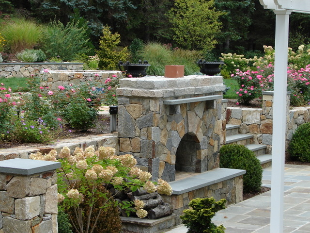 Bolton Landscape Design & Masonry specializing in plantings, sprinkler systems, patios, grills, driveway construction, and grading since 1979. fireplace fire pit